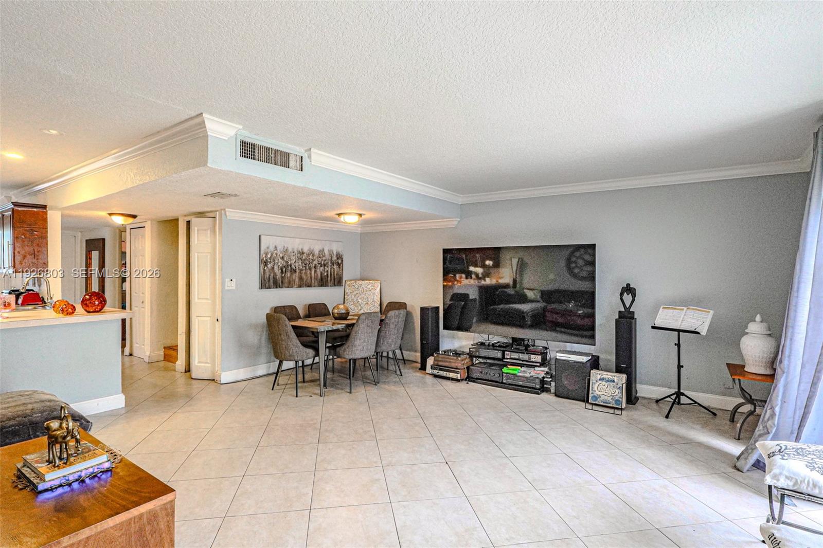 3331 Farragut Street, Unit 8A Hollywood, FL 33021 - Photo 16 of 26 a living room with furniture and a flat screen tv