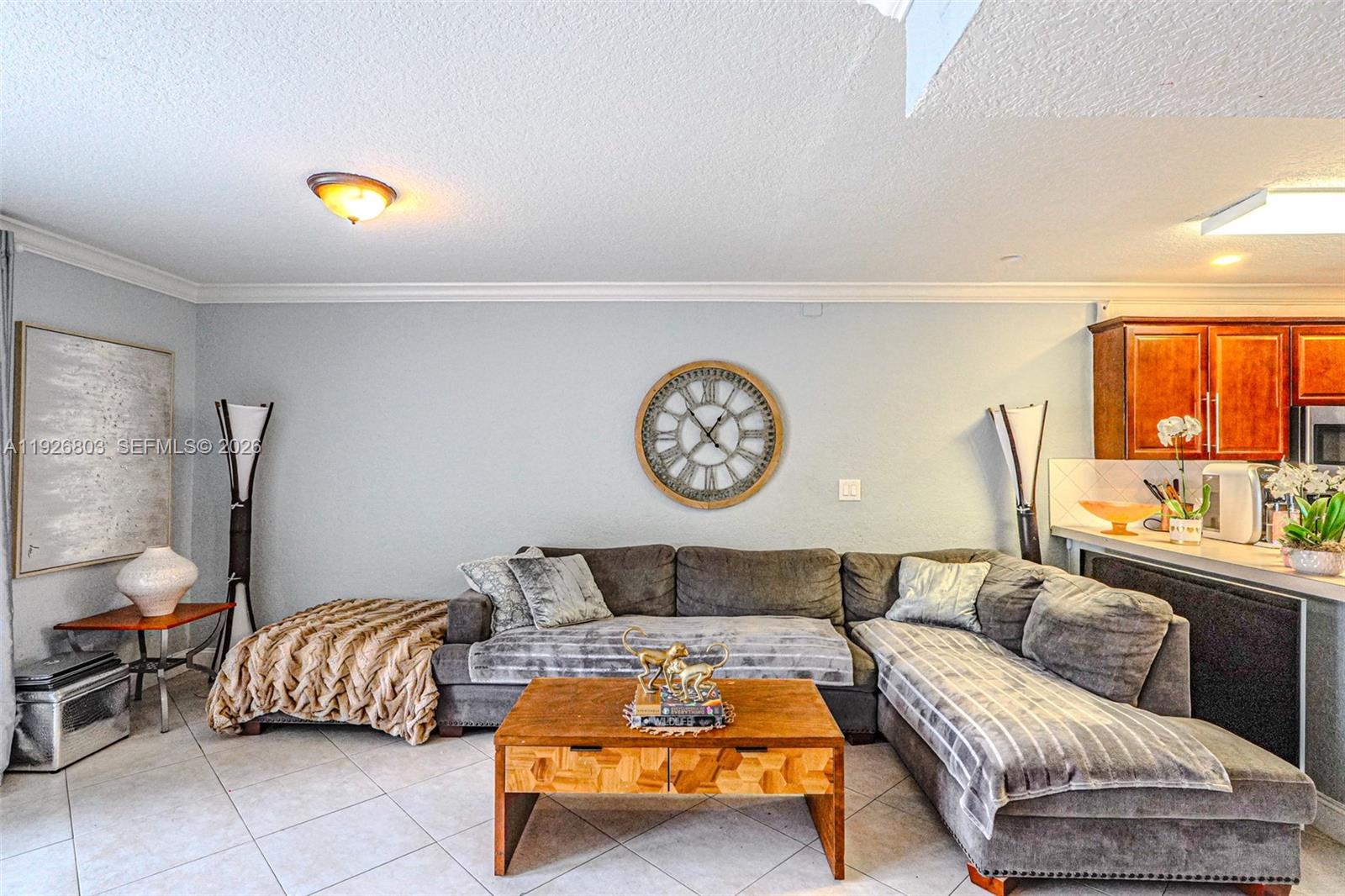 3331 Farragut Street, Unit 8A Hollywood, FL 33021 - Photo 18 of 26 a living room with a couch and a table