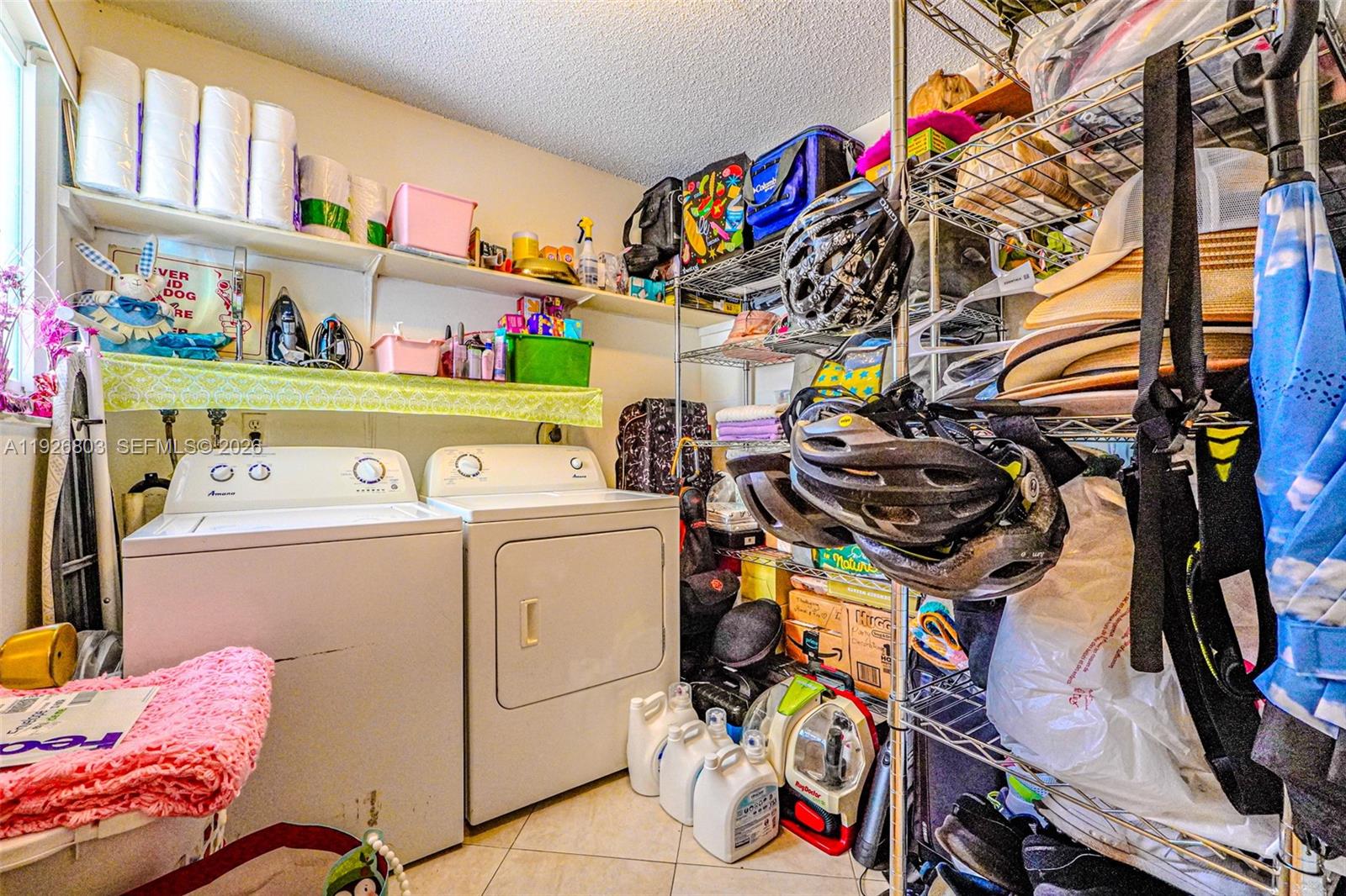 3331 Farragut Street, Unit 8A Hollywood, FL 33021 - Photo 23 of 26 a utility room with dryer washer and other items
