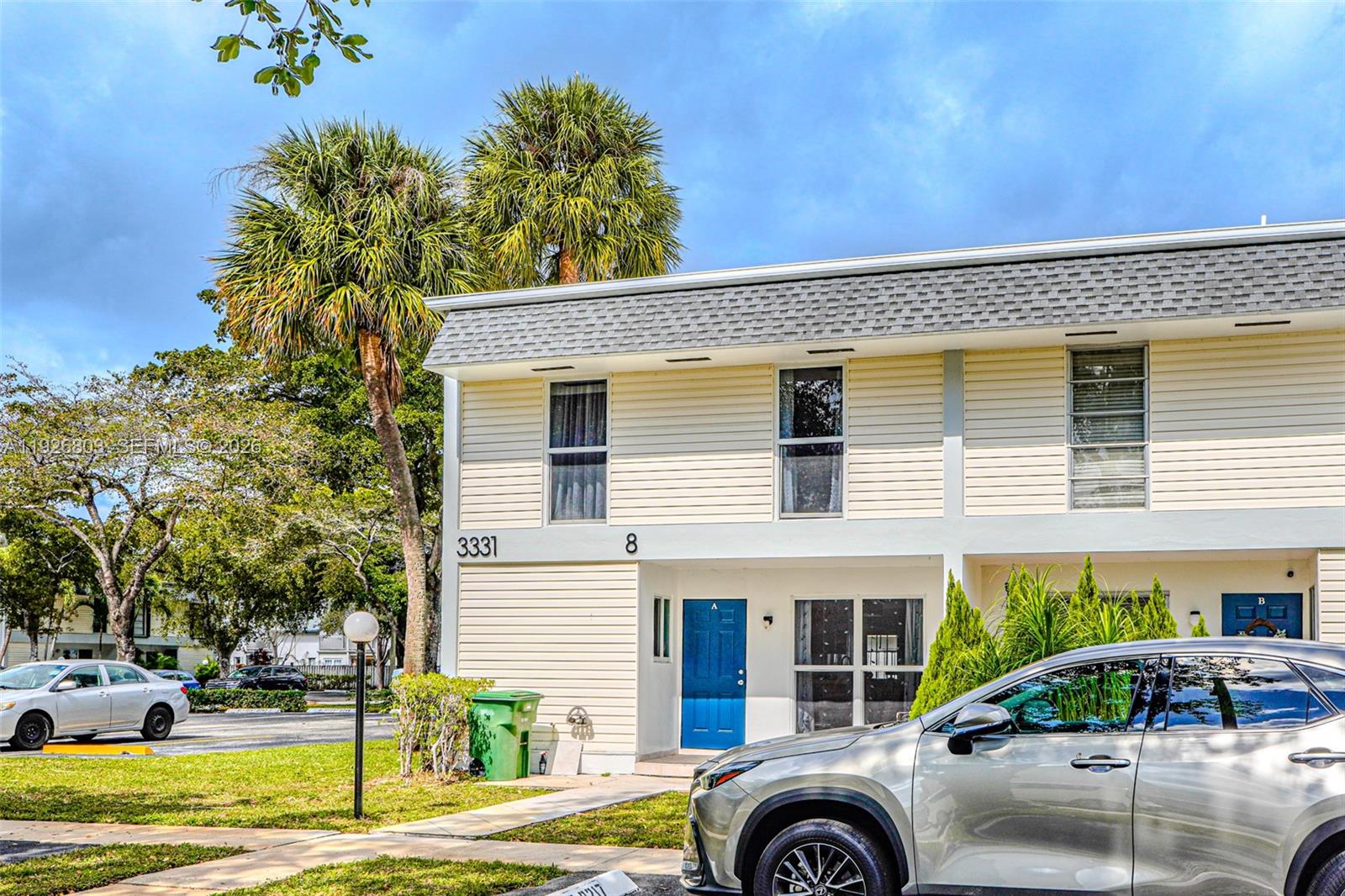 3331 Farragut Street, Unit 8A Hollywood, FL 33021 - Photo 25 of 26 a front view of a house with a garden