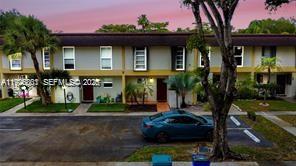 3331 Farragut Street, Unit 8A Hollywood, FL 33021 - Photo 3 of 26 a front view of a house with garden