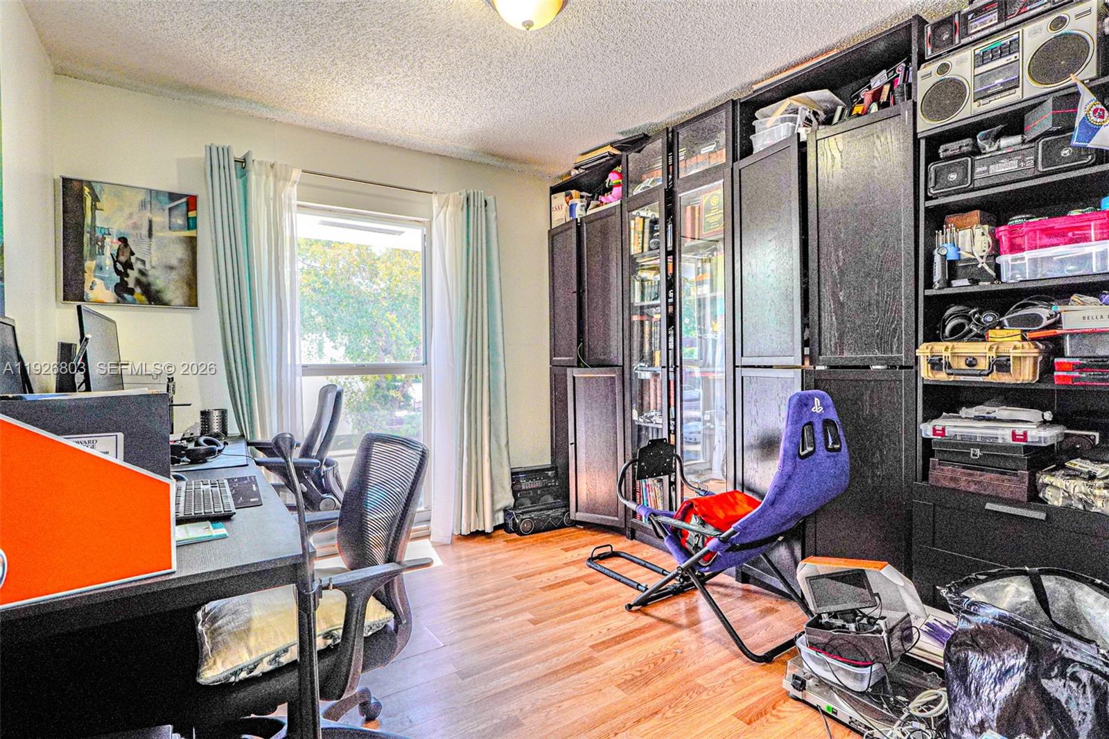 3331 Farragut Street, Unit 8A Hollywood, FL 33021 - Photo 4 of 26 a work room with furniture and floor to ceiling window