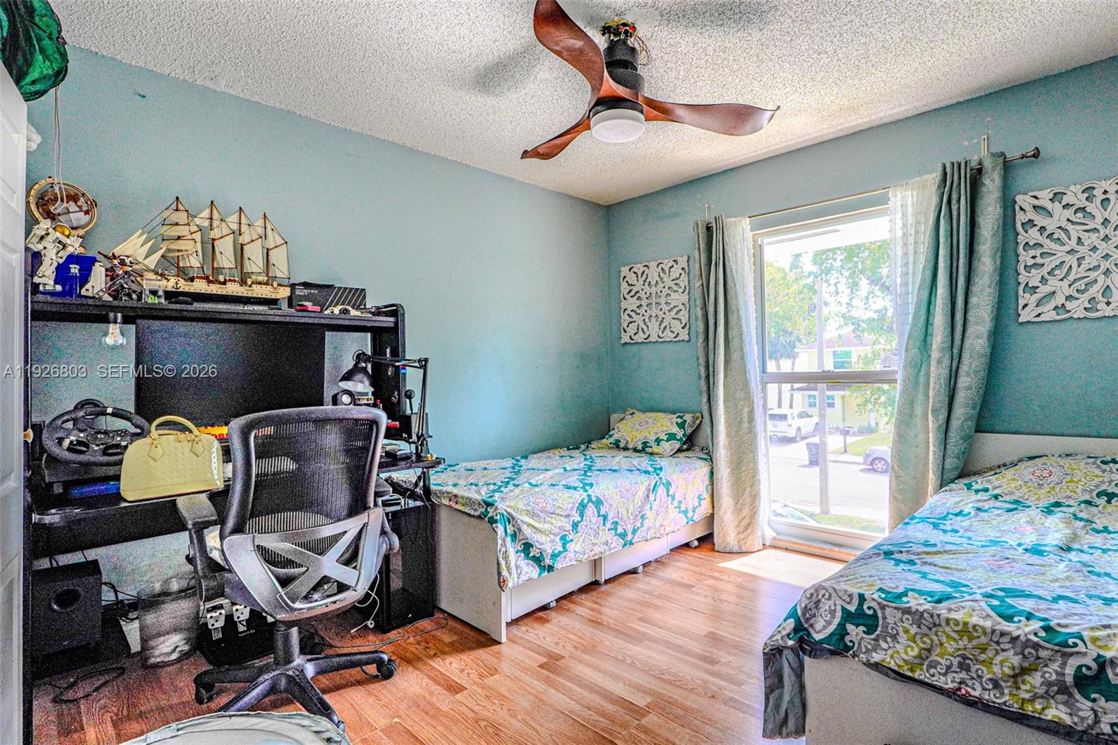 3331 Farragut Street, Unit 8A Hollywood, FL 33021 - Photo 5 of 26 a bedroom with a bed and wooden floor