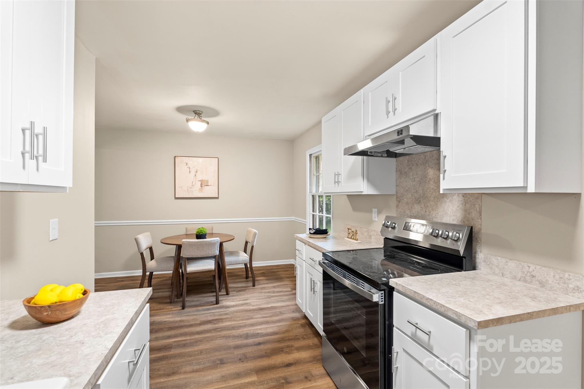 315 High Street Rock Hill, SC 29730 - Photo 17 of 33 a kitchen with stainless steel appliances granite countertop a sink white cabinets and wooden floor