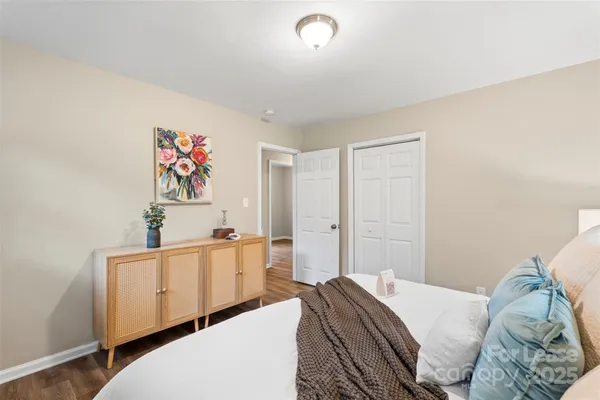 a bedroom with a bed and a desk