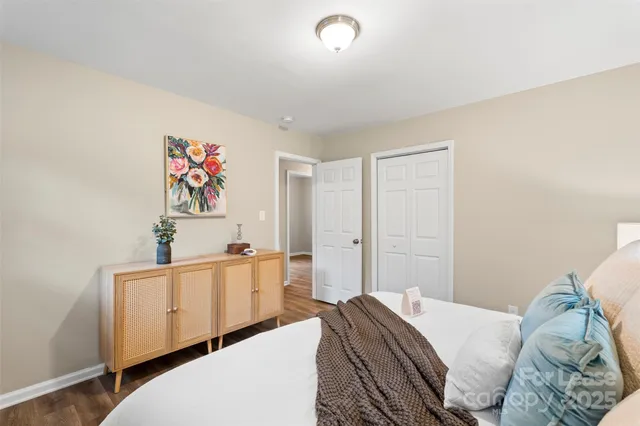 a bedroom with a bed and a desk