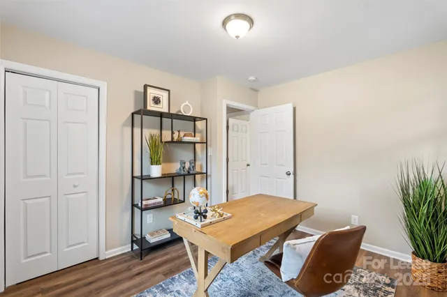 a workspace with furniture and window