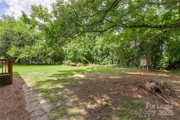 a view of a field with trees