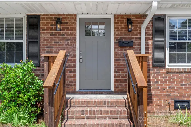 a front view of a house with many windows