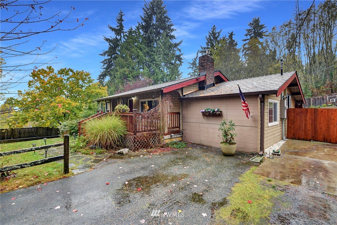 527 240th Street Southwest Bothell, WA 98021 - Photo 2 of 32 a view of a house with a garden