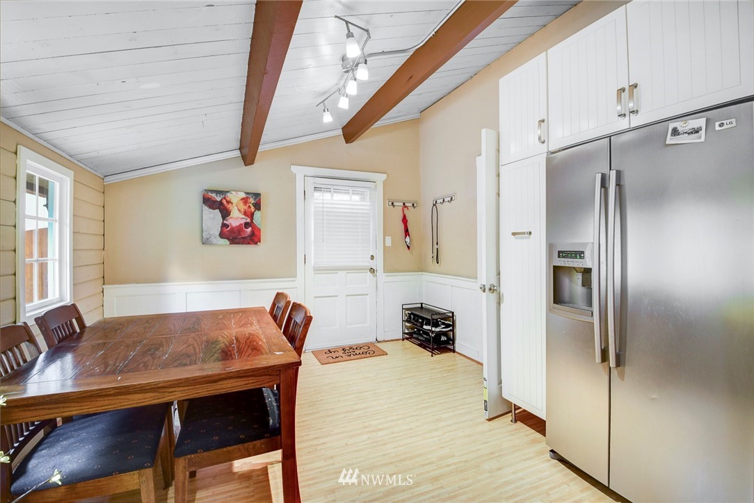 527 240th Street Southwest Bothell, WA 98021 - Photo 11 of 32 a view of kitchen with furniture and refrigerator