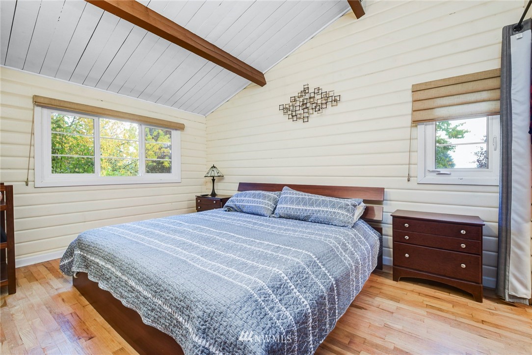527 240th Street Southwest Bothell, WA 98021 - Photo 13 of 32 a bedroom with a bed and a tv