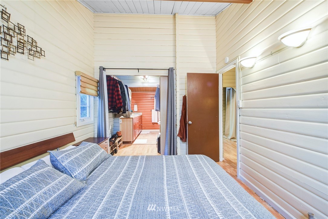 527 240th Street Southwest Bothell, WA 98021 - Photo 14 of 32 a view of a bedroom with wooden floor and stairs