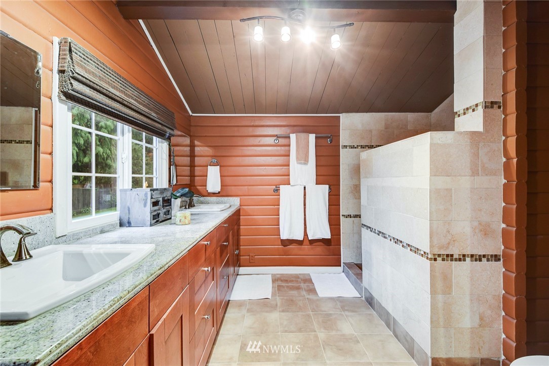 527 240th Street Southwest Bothell, WA 98021 - Photo 16 of 32 a kitchen with granite countertop a sink a counter top space and cabinets