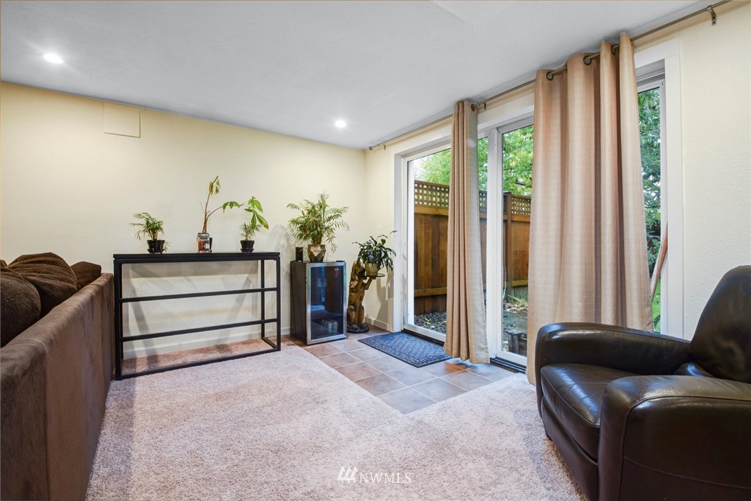 527 240th Street Southwest Bothell, WA 98021 - Photo 19 of 32 a bedroom with furniture and large windows