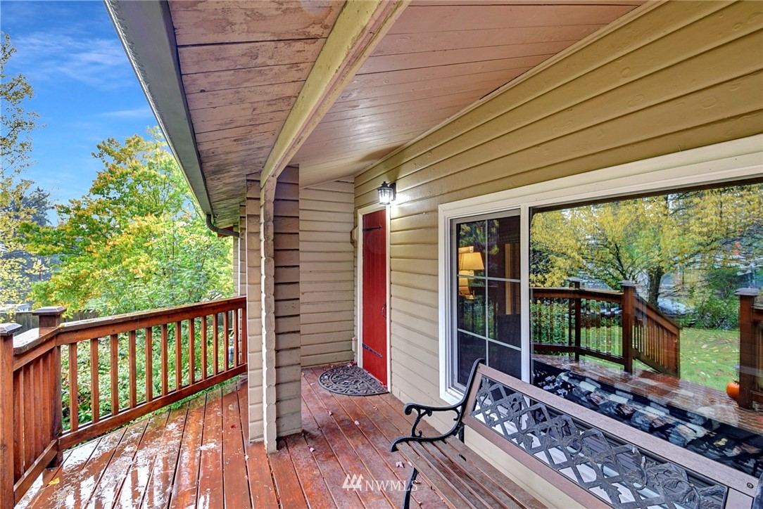 527 240th Street Southwest Bothell, WA 98021 - Photo 3 of 32 a balcony with wooden floor and outdoor space