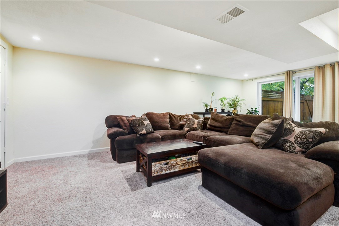 527 240th Street Southwest Bothell, WA 98021 - Photo 21 of 32 a living room with couches and painted walls