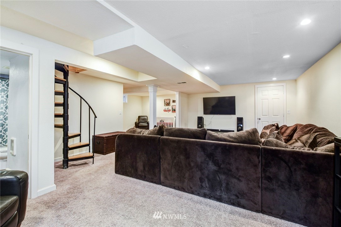 527 240th Street Southwest Bothell, WA 98021 - Photo 22 of 32 a living room with furniture and a flat screen tv