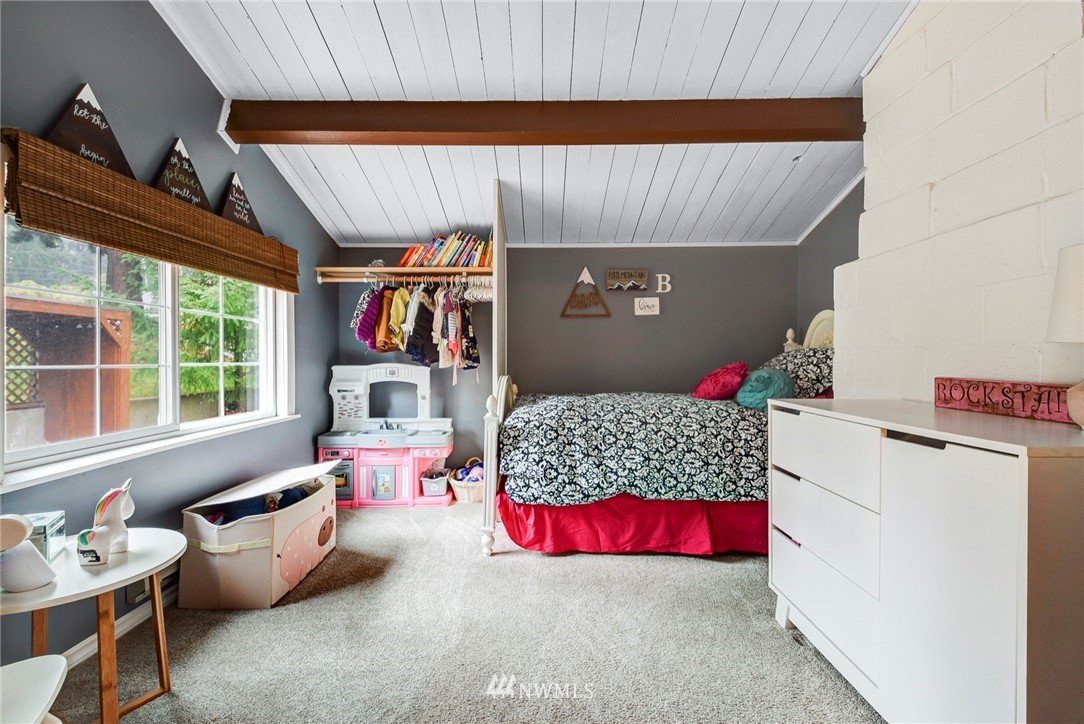 527 240th Street Southwest Bothell, WA 98021 - Photo 24 of 32 a bedroom with furniture and a large window