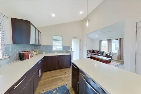 a kitchen with a sink and cabinets
