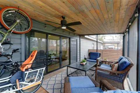 a view of a patio with table and chairs