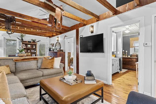 a kitchen with stainless steel appliances granite countertop a sink and a microwave