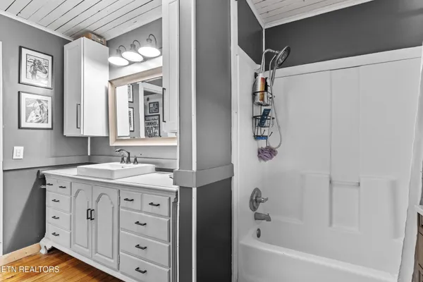 a bathroom with a toilet a sink and a mirror