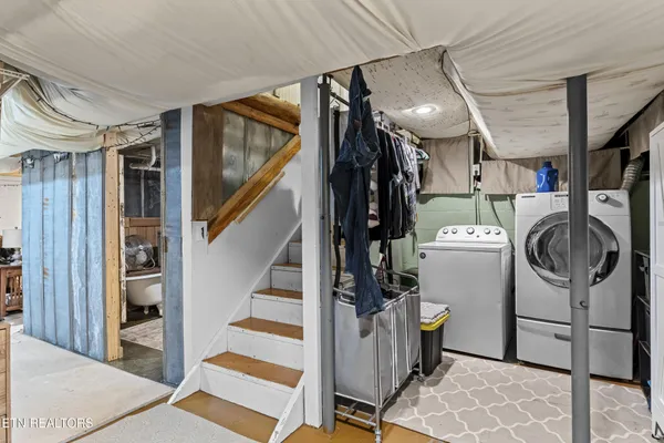 a view of a backyard with sitting area