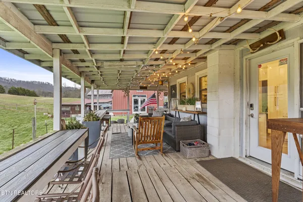 a view of a balcony with lake view and a floor to ceiling window