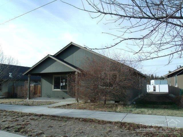 63323 Vogt Road Bend, OR 97701 - Photo 1 of 18 a front view of a house with a yard