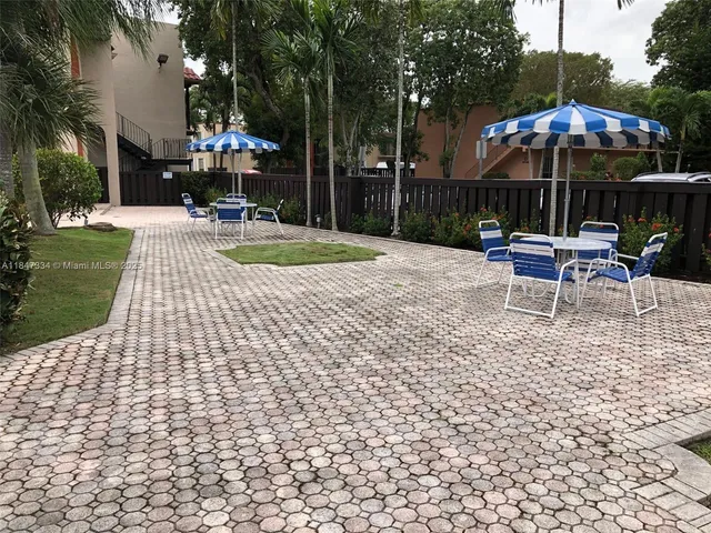 a view of a patio with a yard