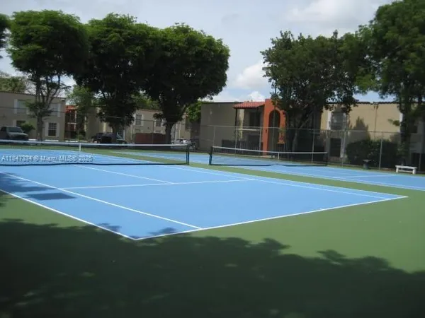 a swimming pool with outdoor seating and yard
