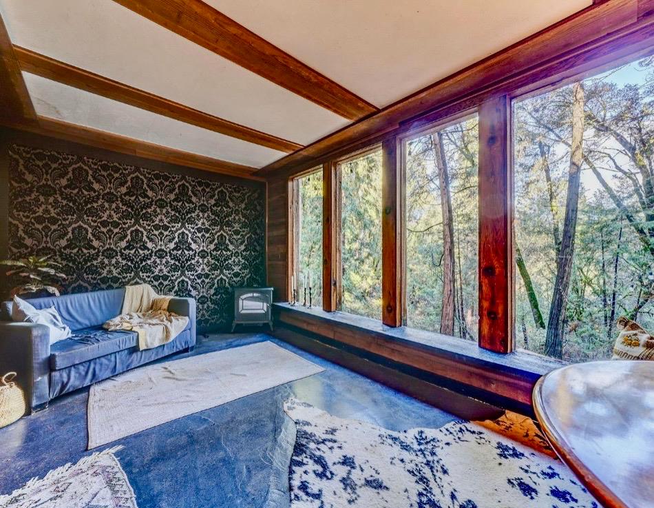 17200 Hale Road Volcano, CA 95689 - Photo 1 of 1 a living room with furniture and a large window