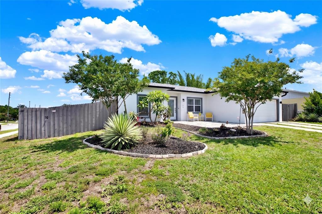 3023 Muir Street Holiday, FL 34691 - Photo 4 of 25 a view of a house with backyard and sitting area