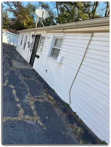 a view of a balcony with wooden floor and fence