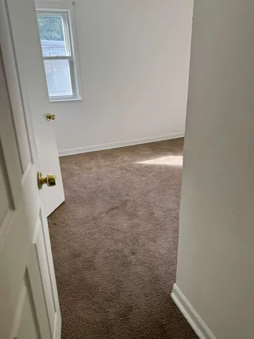 a kitchen with a sink a counter top space cabinets and stainless steel appliances