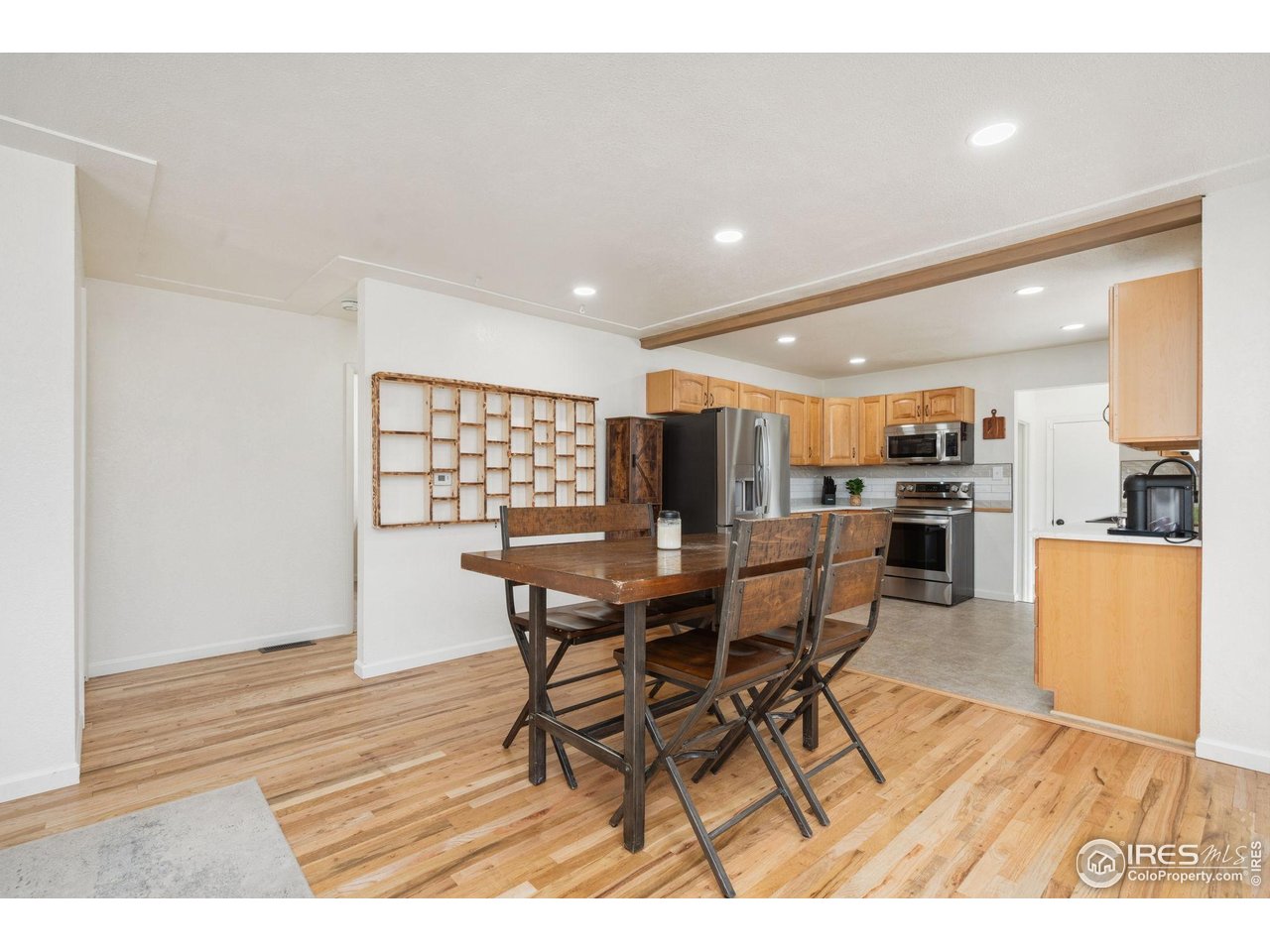 113 Balsam Street Fort Morgan, CO 80701 - Photo 11 of 30 a view of a dining room with furniture and wooden floor