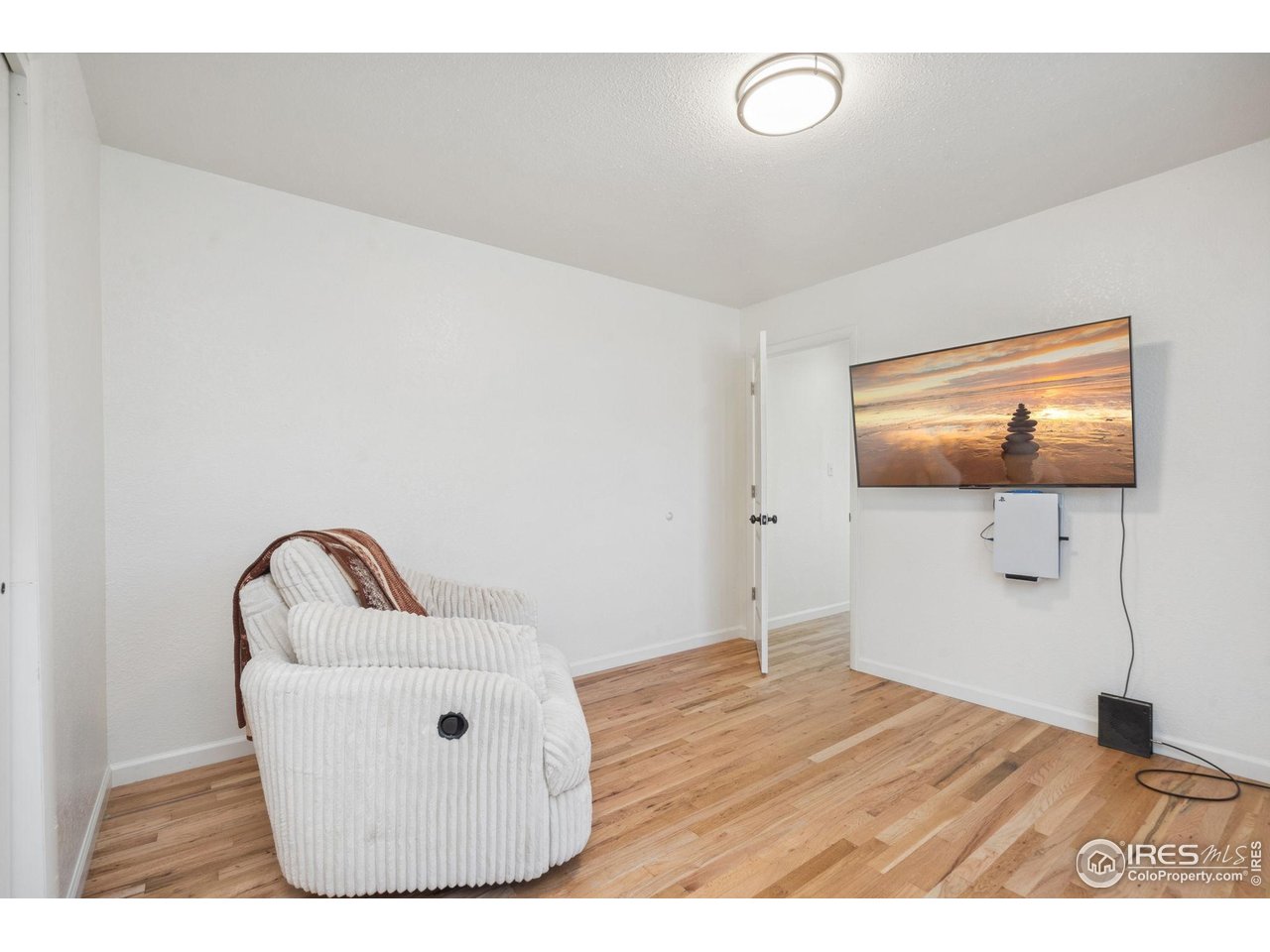 113 Balsam Street Fort Morgan, CO 80701 - Photo 13 of 30 a room with a flat screen tv