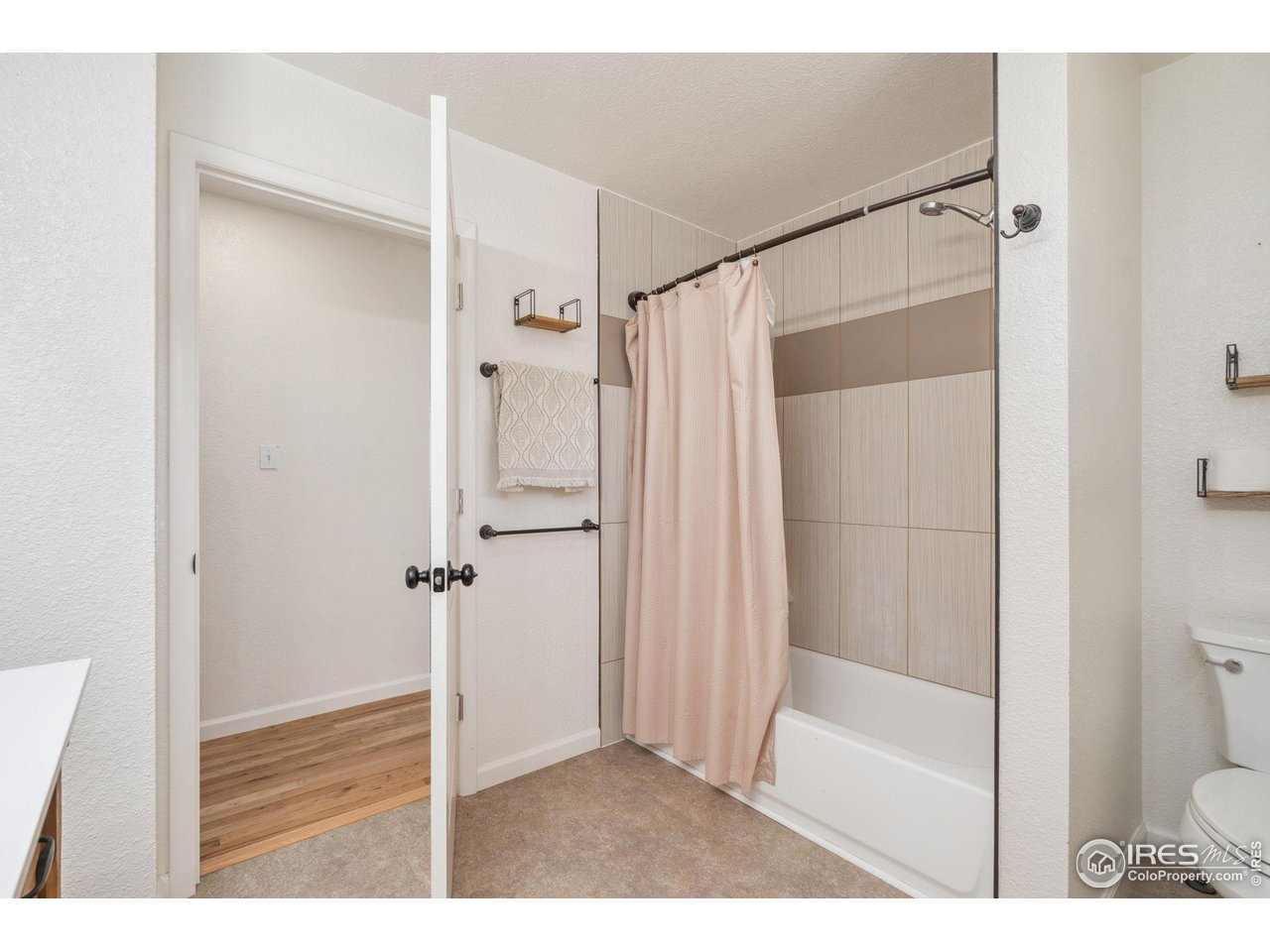 113 Balsam Street Fort Morgan, CO 80701 - Photo 15 of 30 a bathroom with a shower and a toilet