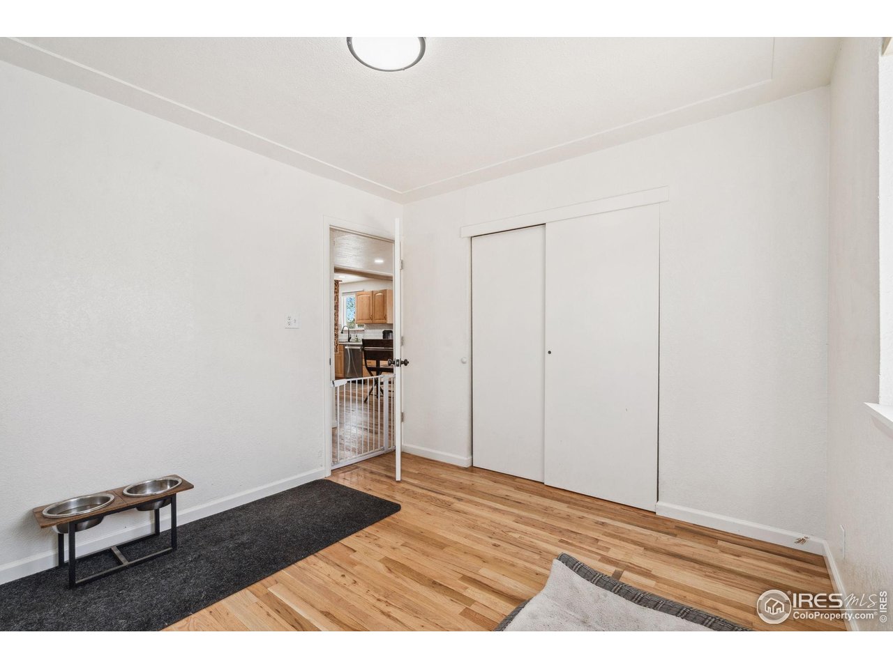 113 Balsam Street Fort Morgan, CO 80701 - Photo 17 of 30 a view of an empty room and wooden floor
