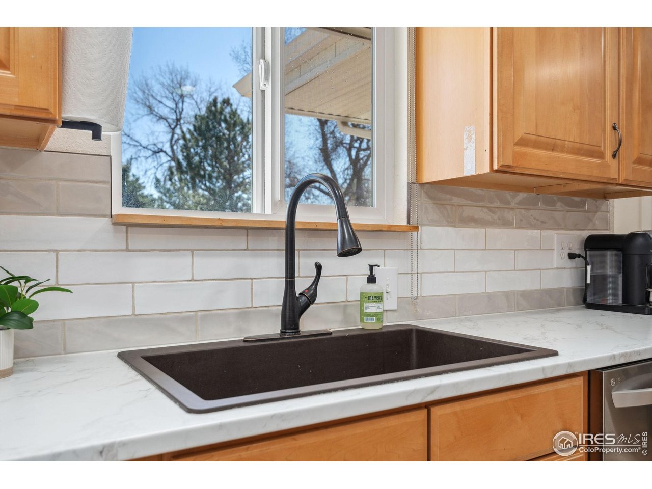113 Balsam Street Fort Morgan, CO 80701 - Photo 7 of 30 a kitchen with a sink and cabinets