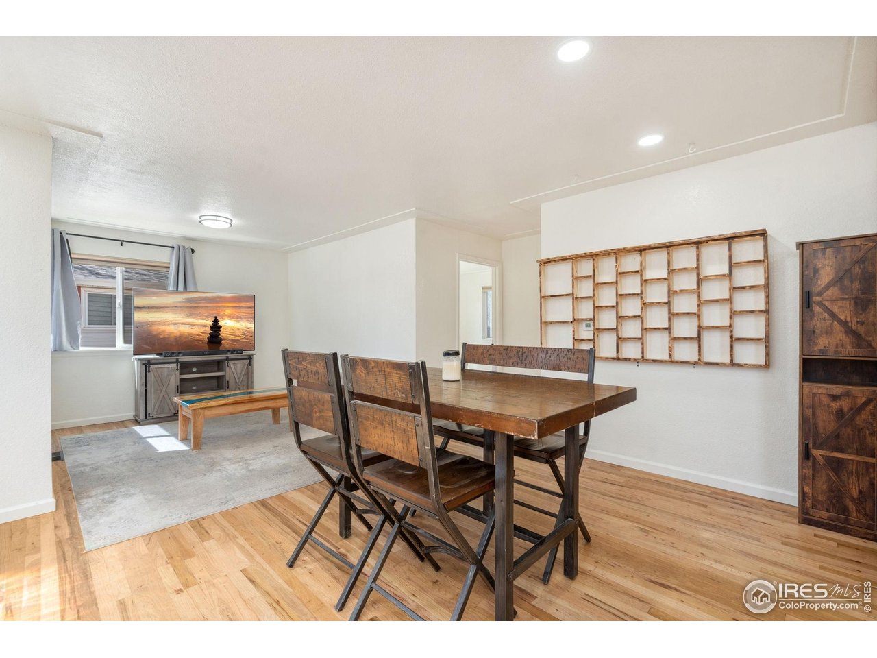113 Balsam Street Fort Morgan, CO 80701 - Photo 9 of 30 a dining room with a wooden table and chairs