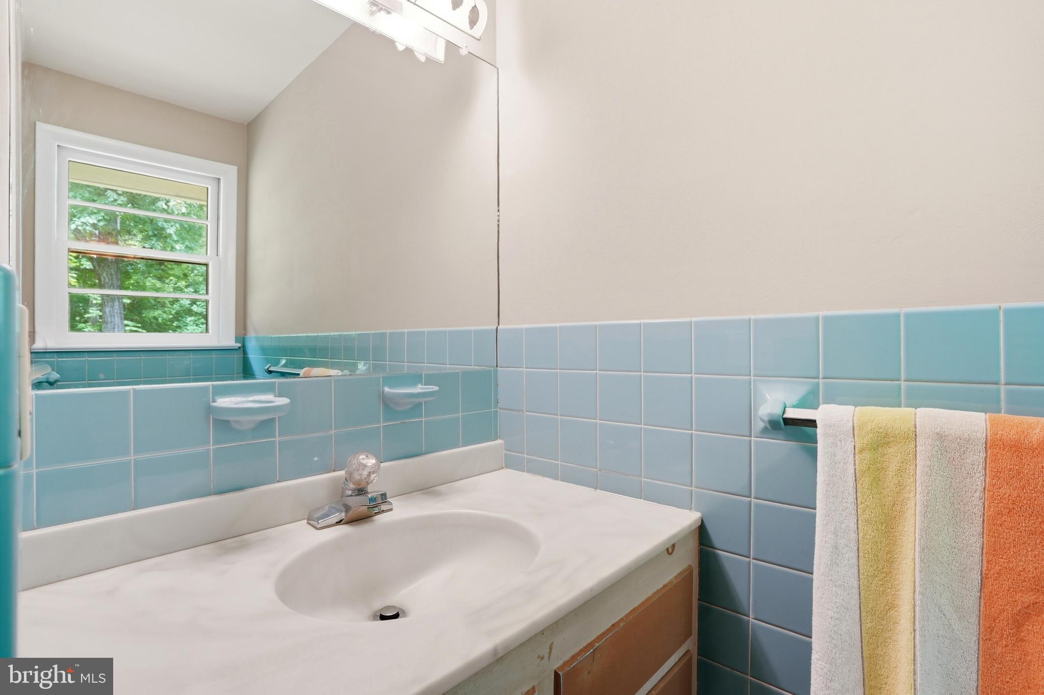 486 Derstine Road Hatfield, PA 19440 - Photo 25 of 53 a bathroom with a sink a toilet and a mirror