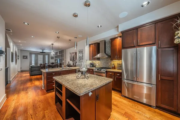 a kitchen with a stove and a refrigerator