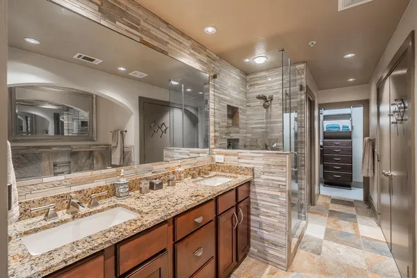 a bathroom with a bathtub and a sink
