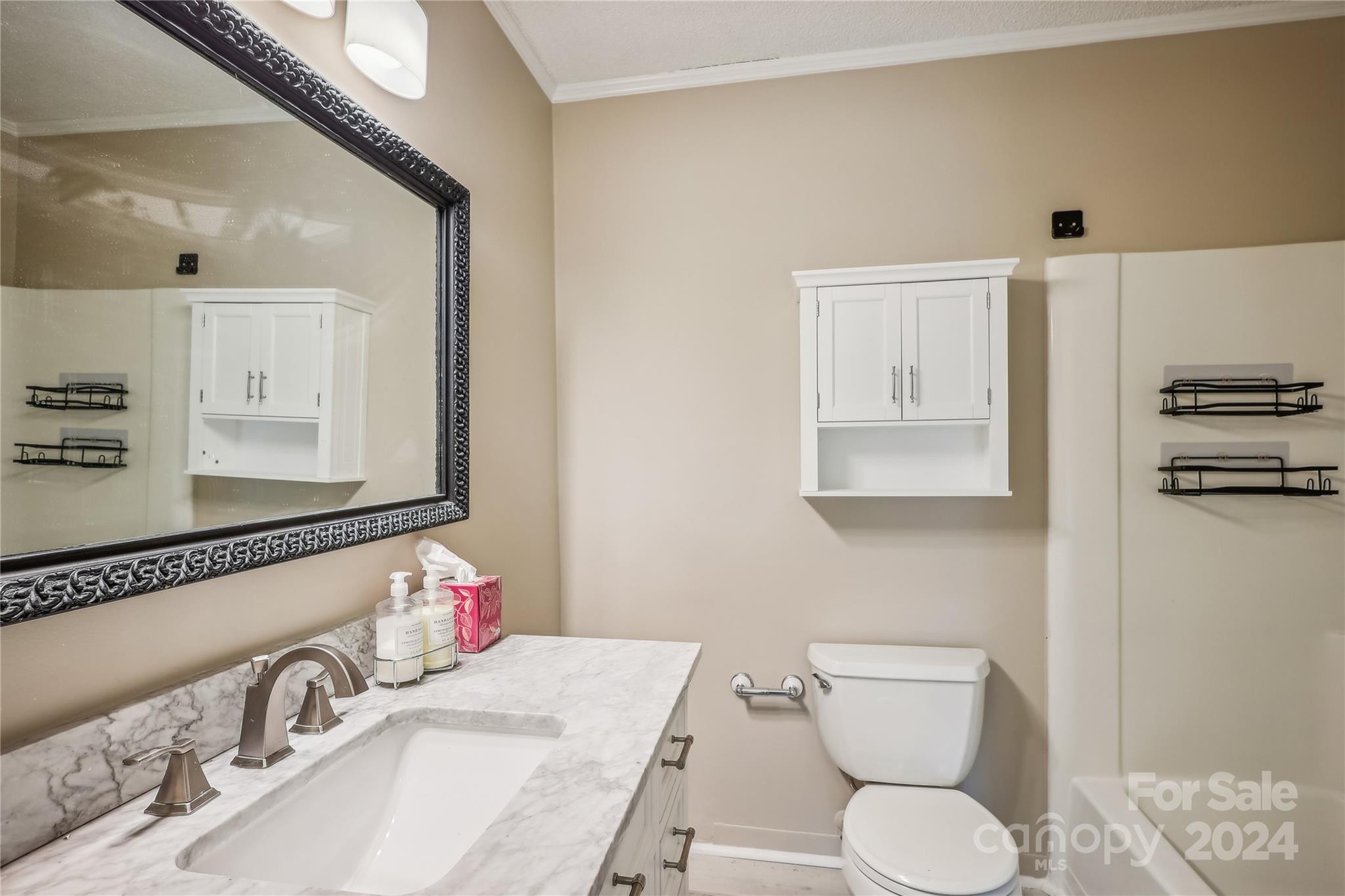 335 Pine Valley Road Salisbury, NC 28147 - Photo 14 of 31 a bathroom with a toilet sink and mirror