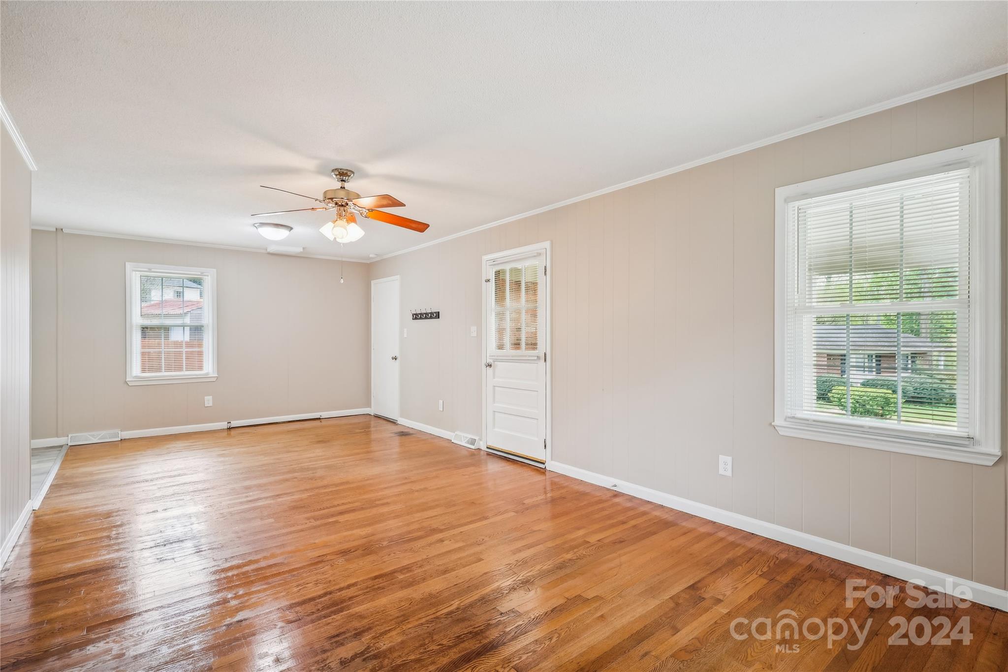 335 Pine Valley Road Salisbury, NC 28147 - Photo 22 of 31 a view of an empty room with wooden floor and a window