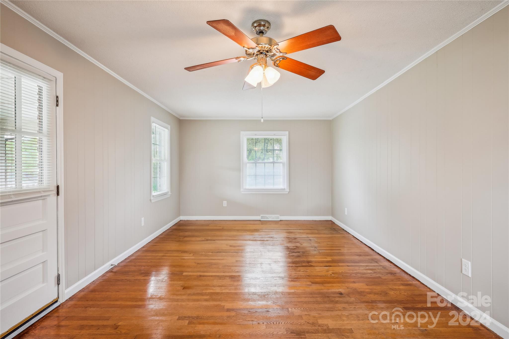 335 Pine Valley Road Salisbury, NC 28147 - Photo 23 of 31 a view of an empty room with wooden floor and a window