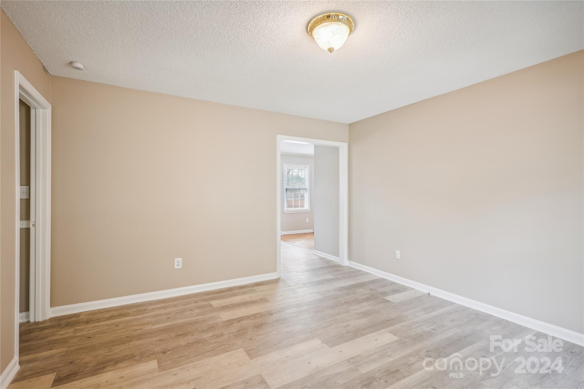 335 Pine Valley Road Salisbury, NC 28147 - Photo 24 of 31 a view of an empty room with wooden floor