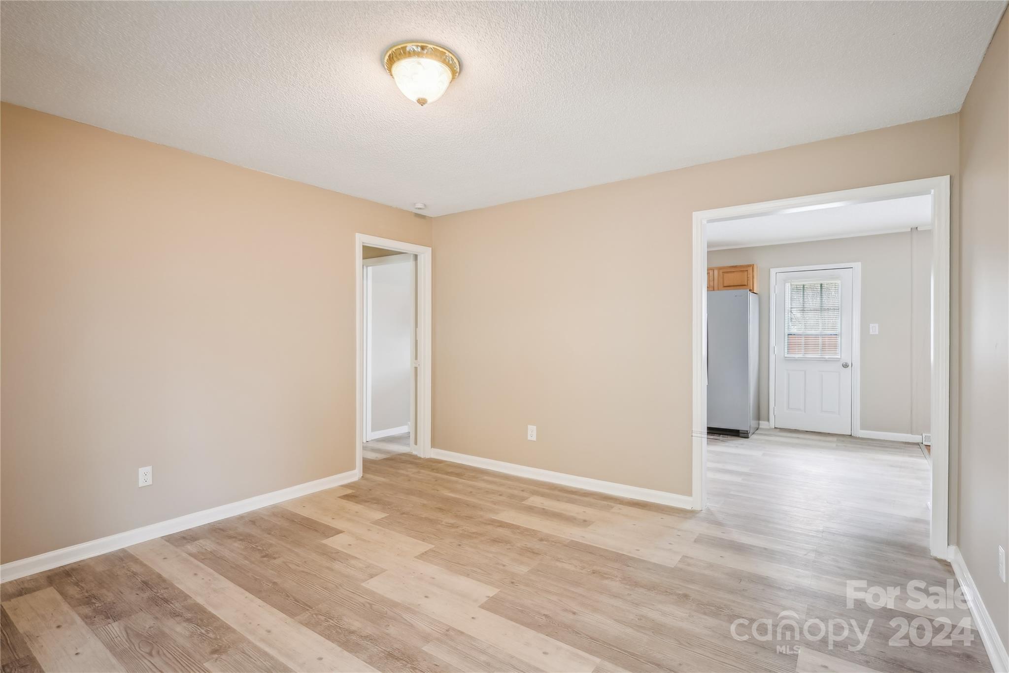 335 Pine Valley Road Salisbury, NC 28147 - Photo 25 of 31 a view of an empty room with wooden floor
